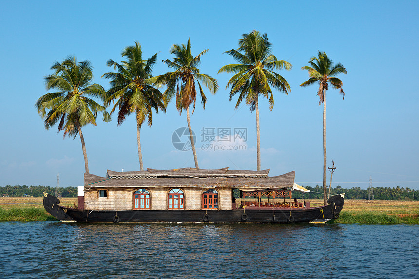 印度喀拉拉腊背水上的豪船棕榈风景运河闲暇旅游渡船血管旅行日落船屋图片