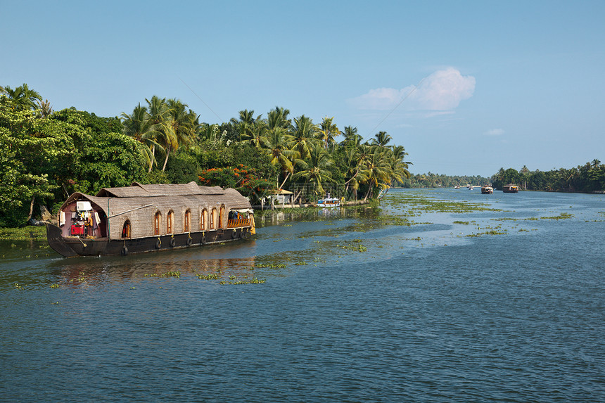 印度喀拉拉腊背水上的豪船闲暇巡航死水旅游旅行热带船屋风景运河日落图片