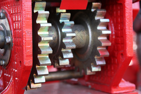 种子分离机上的大型链条驱动器宏观工作流动圆形运动车轮金属技术力量机器背景图片