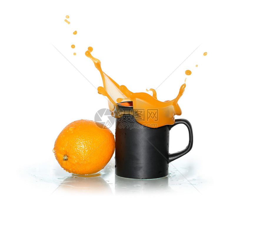 挥洒橙汁饮料飞溅素食者杯子水果液体餐具早餐果汁饮食图片
