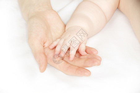 婴儿的手女性手指女士妈妈生活母亲家庭父母孩子女孩会议高清图片素材