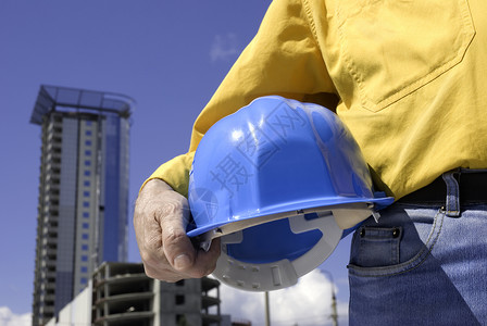 正在施工中班级安全帽衣服建筑师承包商手臂蓝色黄色职业联盟背景图片