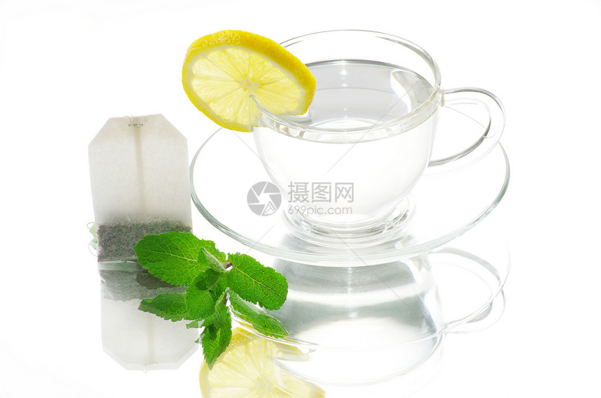 茶杯中的茶绿色香味食物柠檬盘子健康饮食薄荷植物液体水果图片