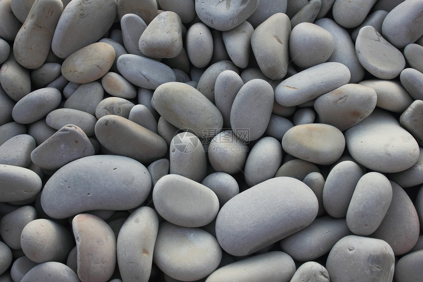 孔框背景背景灰色海滩石头圆形海岸图片