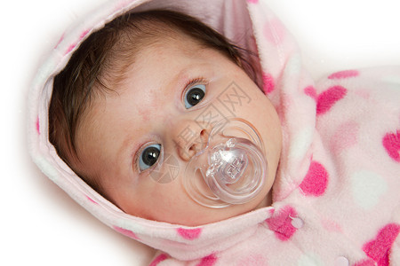 带有奶嘴的婴儿白色眼睛粉色背景图片