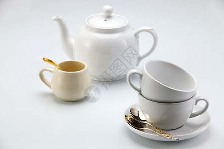 茶壶陶瓷宏观用具咖啡白色水平团体牛奶容器杯子背景图片