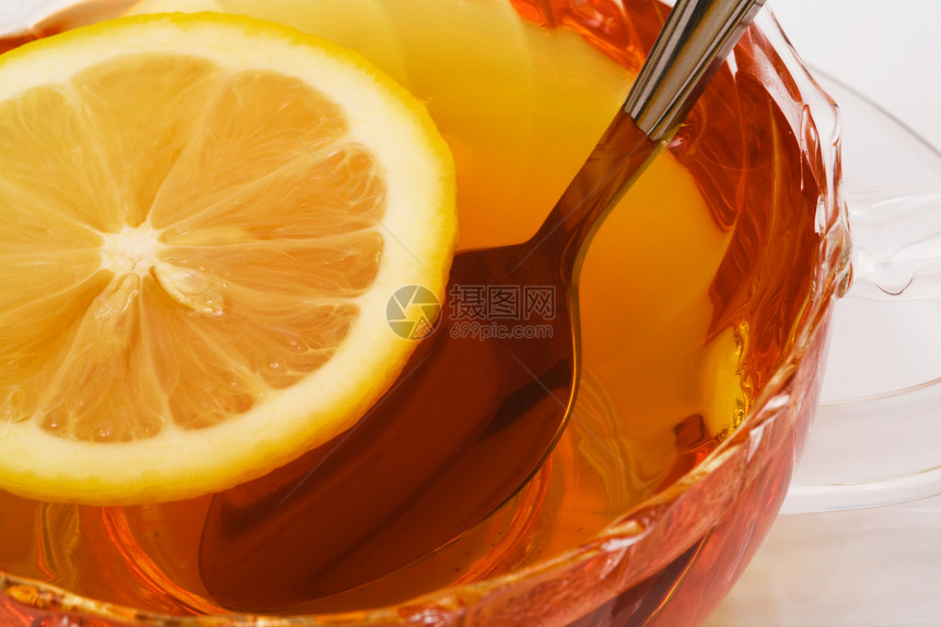 茶和柠檬棕色黄色宏观玻璃飞碟勺子食物水平杯子水果图片