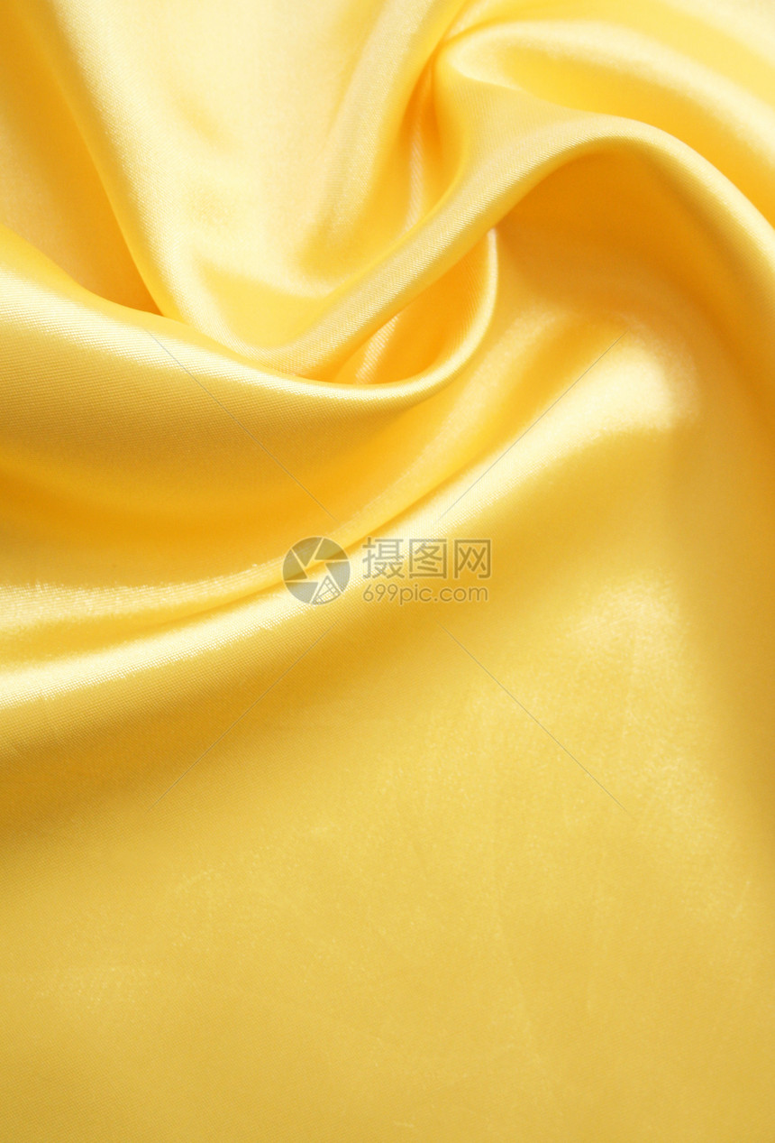 平滑优雅的金金丝绸海浪织物涟漪材料黄色纺织品投标感性折痕丝绸图片
