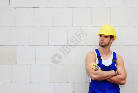 手工工人石匠工业领班外墙工匠工地白色防护服建筑业体力劳动者年轻人高清图片素材