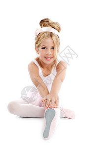 Ballerina 芭蕾小芭蕾舞儿童舞蹈者孩子训练演员童年舞蹈微笑裙子幸福女性金发背景图片