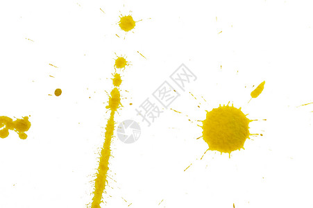 黄色斑点飞沫圆圈液体墨水白色背景图片