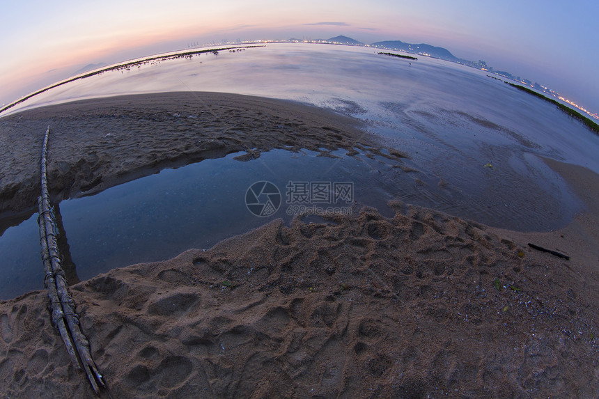 香港海岸一带的日落地平线力量植物太阳反射旅行海岸线海洋岩石橙子图片