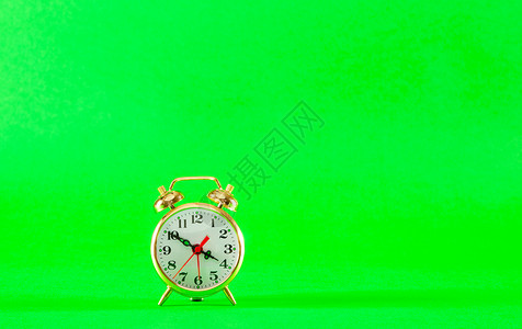 金金反金风格闹钟戒指圆形金属合金绿色小时钟声背景时间圆圈背景图片