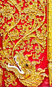 墙上土生土生土长的Thai风格的黄金图科设计装饰手工石膏宽慰浮雕植物传统古董雕刻寺庙背景图片