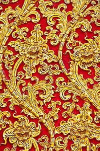 墙上土生土生土长的Thai风格的黄金图科设计艺术工艺传统装饰品浮雕手工寺庙雕刻宽慰装饰背景图片