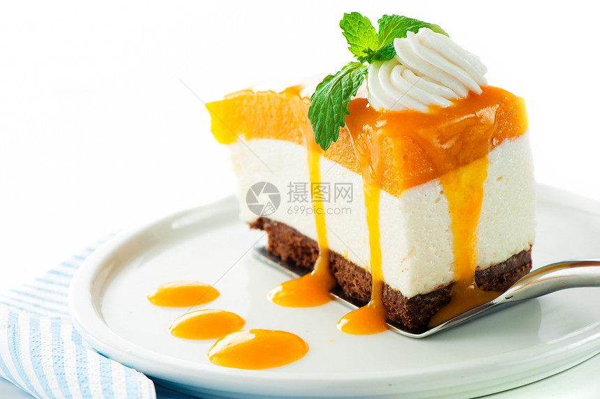 一个芒果奶酪蛋糕 白色背景的芒果芝士蛋糕 作为工作室sho橙子奶油诱惑果汁巧克力糕点馅饼蛋糕柠檬盘子图片