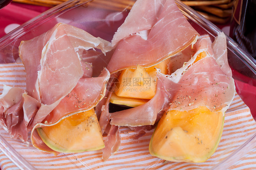 含意大利火腿的坎塔罗普甜瓜黄色水果食物西瓜野餐营养饮食橙子午餐小吃图片