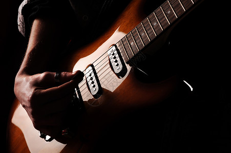 吉他手玩家青年音乐会岩石活力明星浅色吉他乐趣文化背景图片