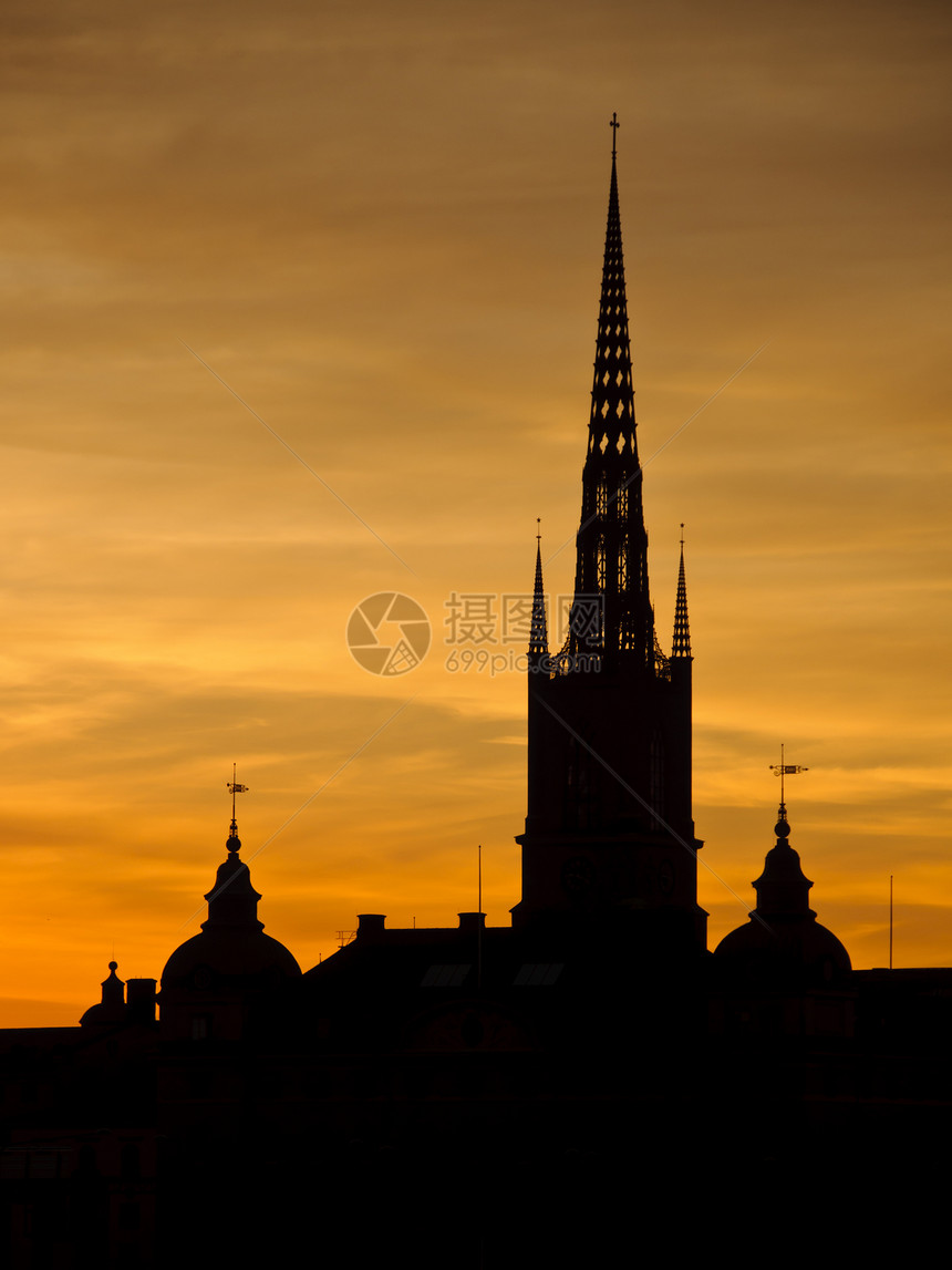 日落时斯德哥尔摩市风景房子地标太阳历史性景观大厅首都大教堂天空城市图片