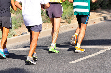 马拉松赛车慢跑者竞赛跑步者短跑人群短裤领导者运动鞋慢跑比赛背景图片