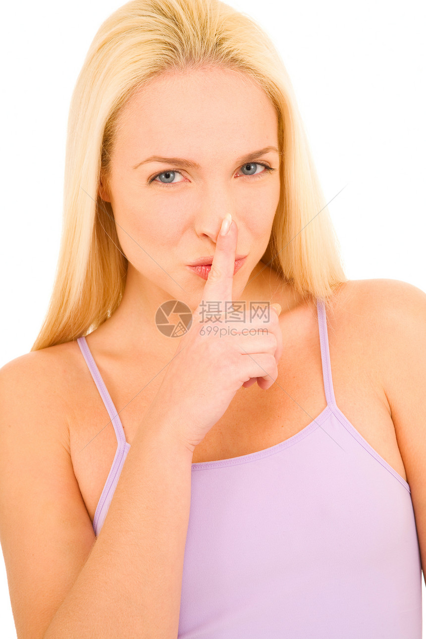 女人用手指指着嘴的沉默女士长发成人金发女郎女子年轻人金发手势图片