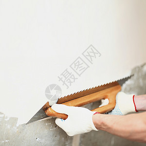 工作与块状墙对齐维修石膏工人刀刃泥水匠工具地面水泥建造建设者背景图片
