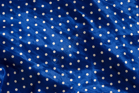 波尔卡圆点圆点织物缝纫蓝色丝绸材料背景