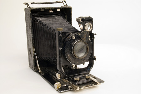 旧古典摄影机有毛皮光学照片相机黑色摄影格式白色机械镜片收藏品背景图片