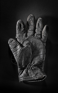 旧手套风化垃圾皮革黑色背景图片