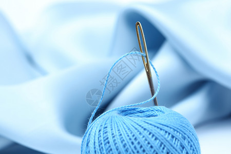 线缝纫衣服刺绣蓝色纺织品爱好裁缝棉布细绳工作背景图片