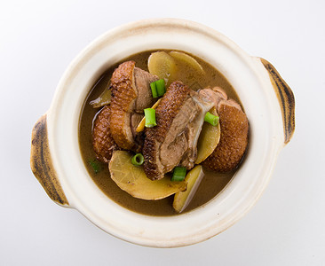 鸭食带以中国炖鸭为食油炸美食酱料香菜午餐洋葱烹饪食物桌子平底锅背景