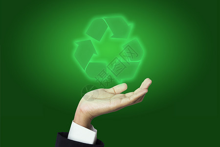 持有回收标志的商务人士个性头脑成人男性荧光一只手领带套装绿色背景图片