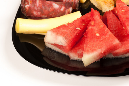 带冷肉的瓜水平起动机服务香肠水果筹码盘子背景图片