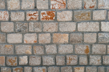 旧墙墙石头砖块积木风化水泥路面石工材料背景图片