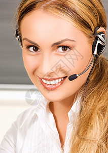 帮助热线商业女性代理人耳机女孩微笑顾问服务快乐助手手机高清图片素材