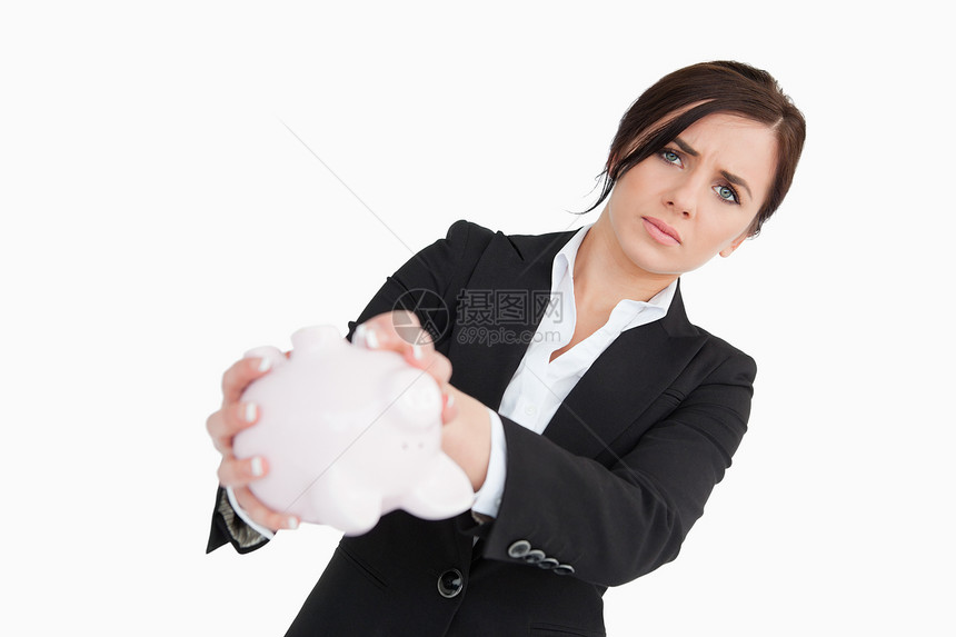 拥有空小猪银行的不安女商务人士图片