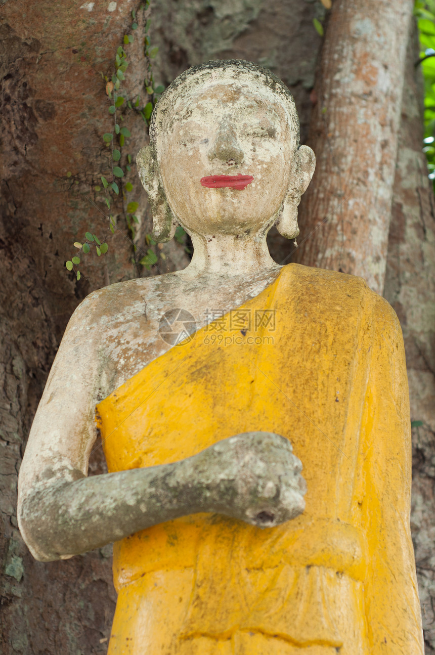 被废弃的佛教雕像水泥黄色图片