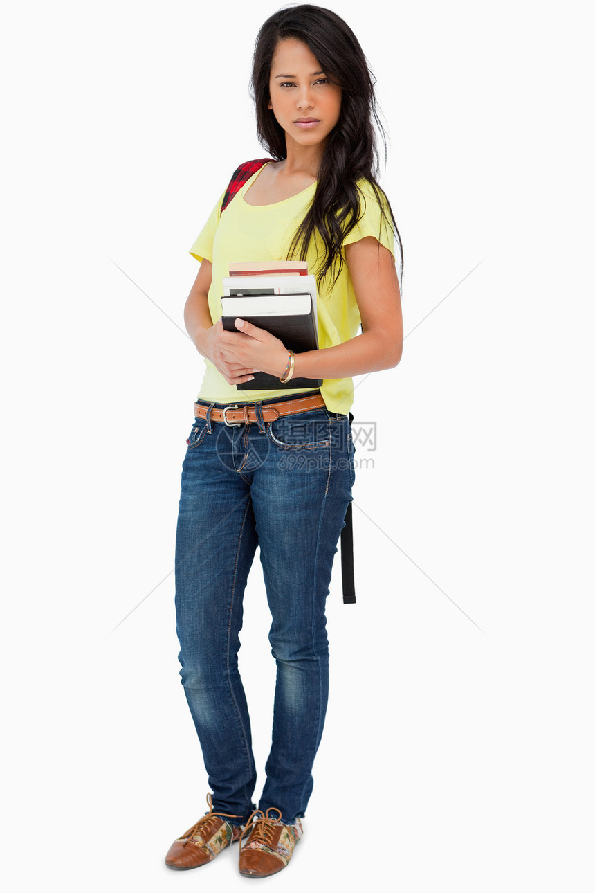 拥有背背包持有教科书的漂亮拉丁学生图片
