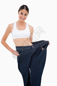 年轻女人瘦了好多体重背景图片