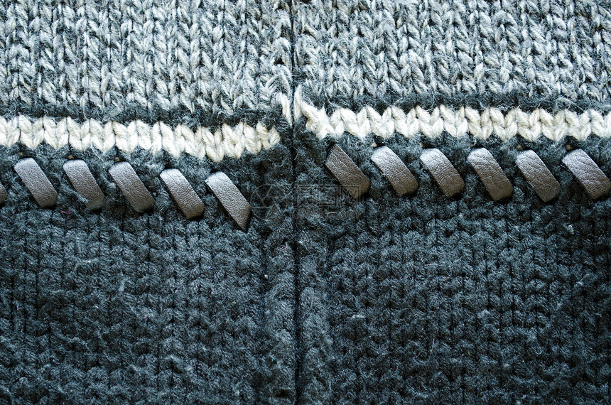 羊毛毛编织毛衣皮革缝合的背景图片