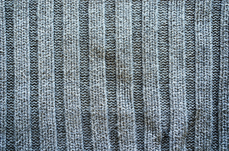 Grey knit 羊毛垫缝合布料背景宏观灰色材料手工纺织品织物针织毛衣装饰棉布背景图片