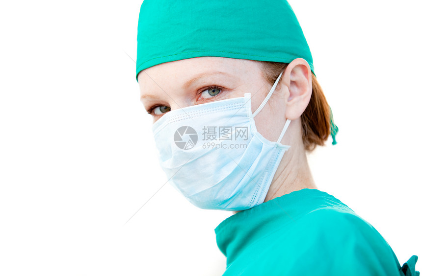 戴面罩的有魅力的女性外科医生图片