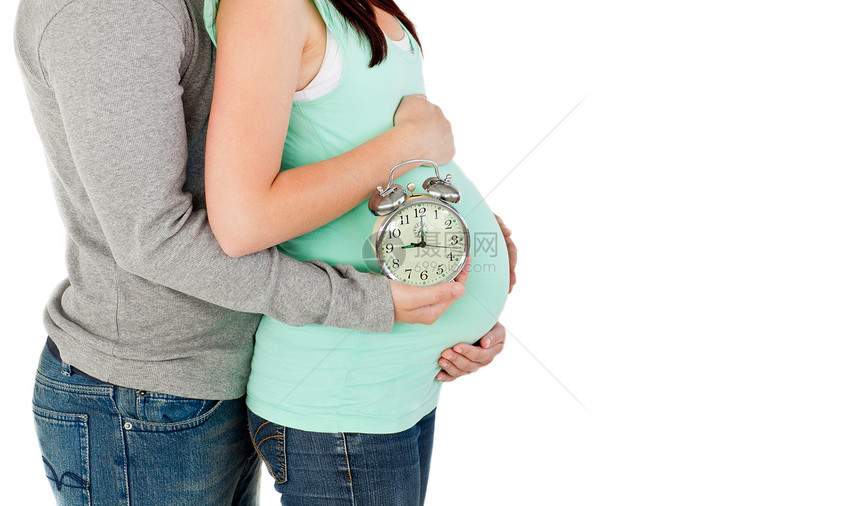 亲爱的将来父母对着一个时钟和一时兴图片