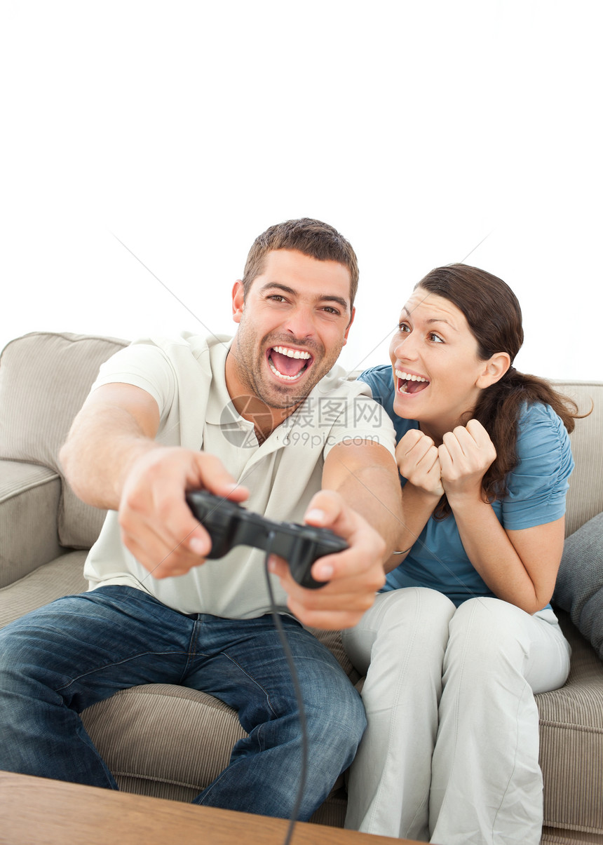 欢欣鼓舞的女人鼓励她男朋友玩电玩游戏图片