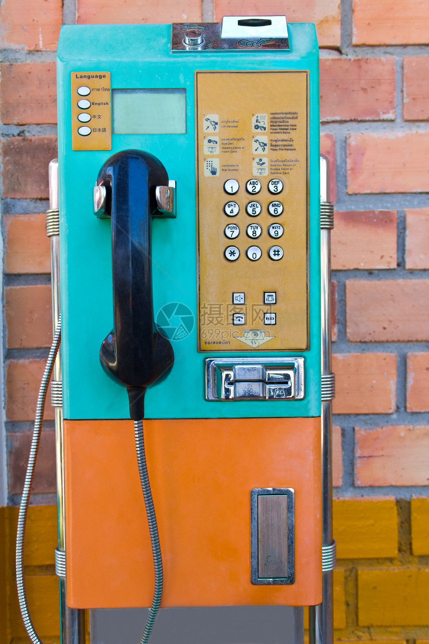 墙上的付费电话拨号数字商业城市展示戒指街道讲话绳索电讯图片