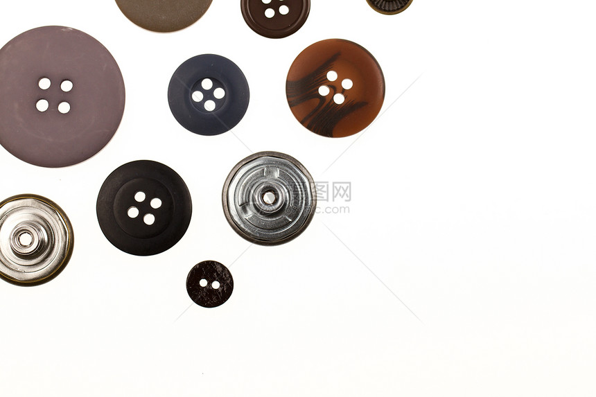 收藏不同按钮的集合金属纺织品圆圈棕色木头苦恼裁缝圆形白色衣服图片