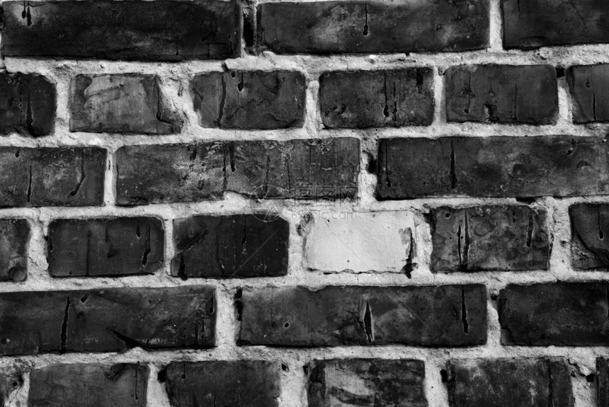 黑白染黑的旧砖墙图片