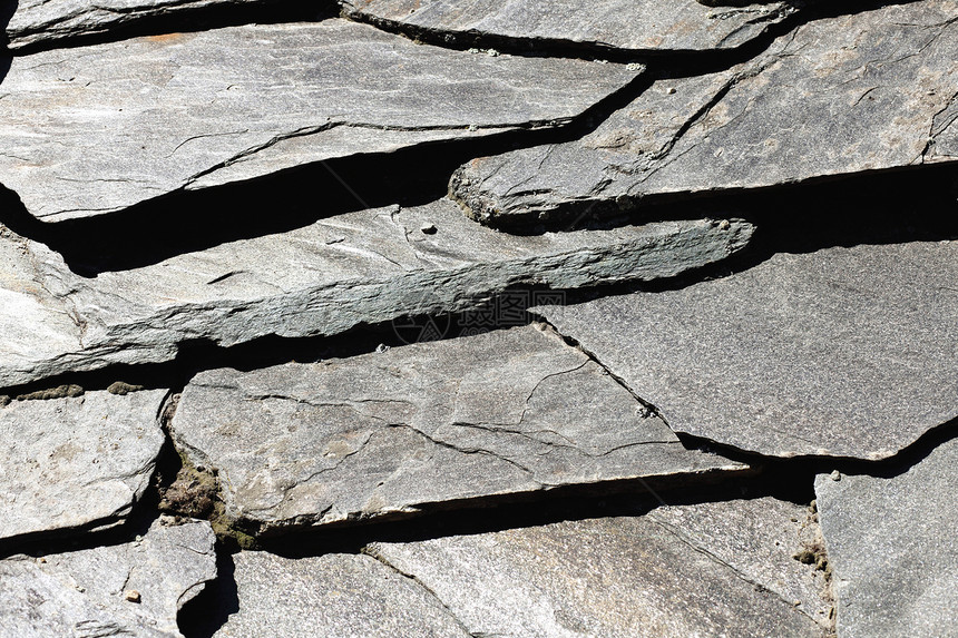 石墙的自然形态大理石风化花岗岩装饰黏土建筑柜台矿物材料宏观图片