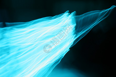 蓝色光源光线模糊通电荧光信号光源物理照明射线视觉流光发光棒背景