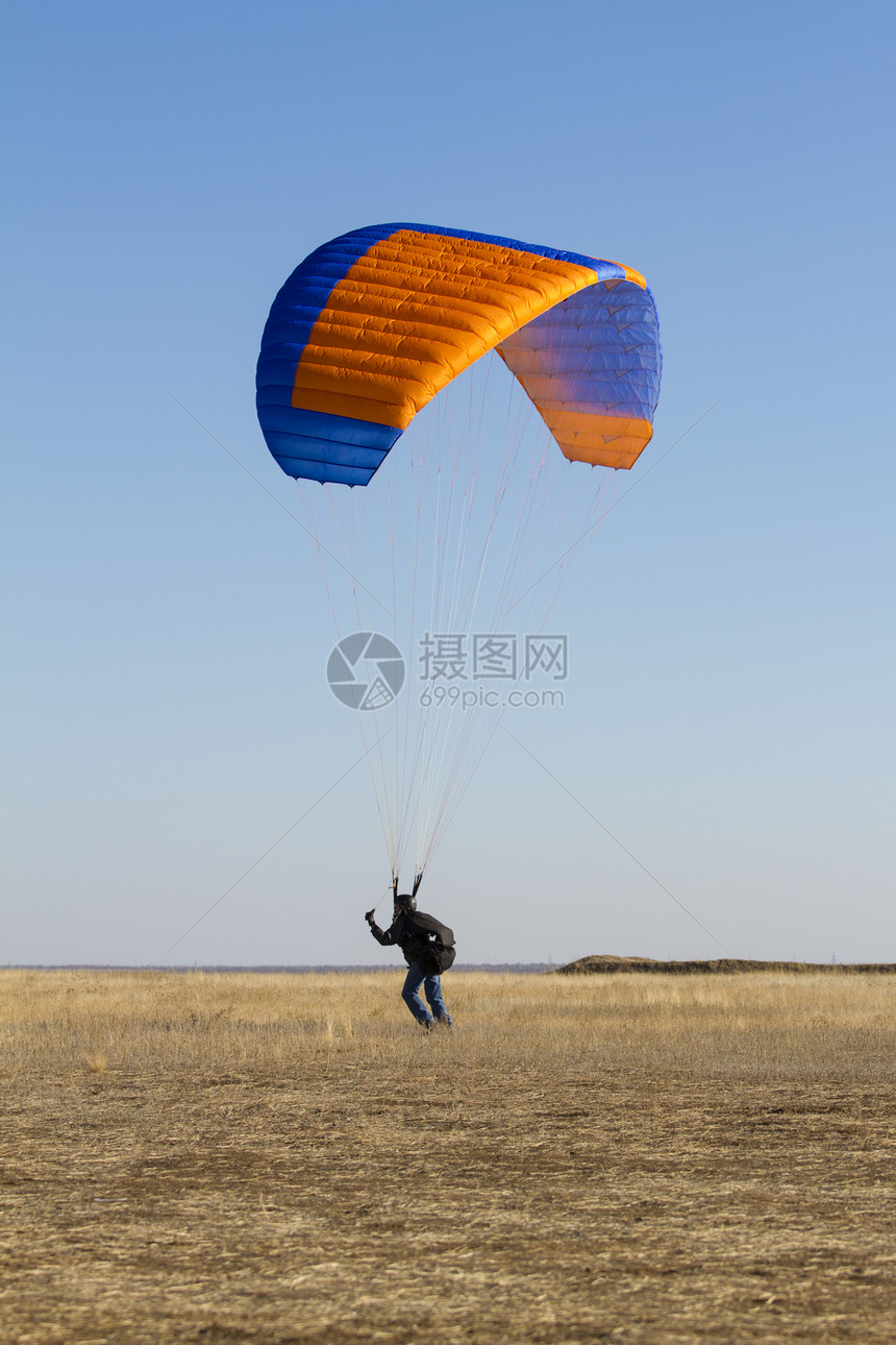 滑行滑动跳伞闲暇橙子空气航班自由男人风险翅膀男性图片